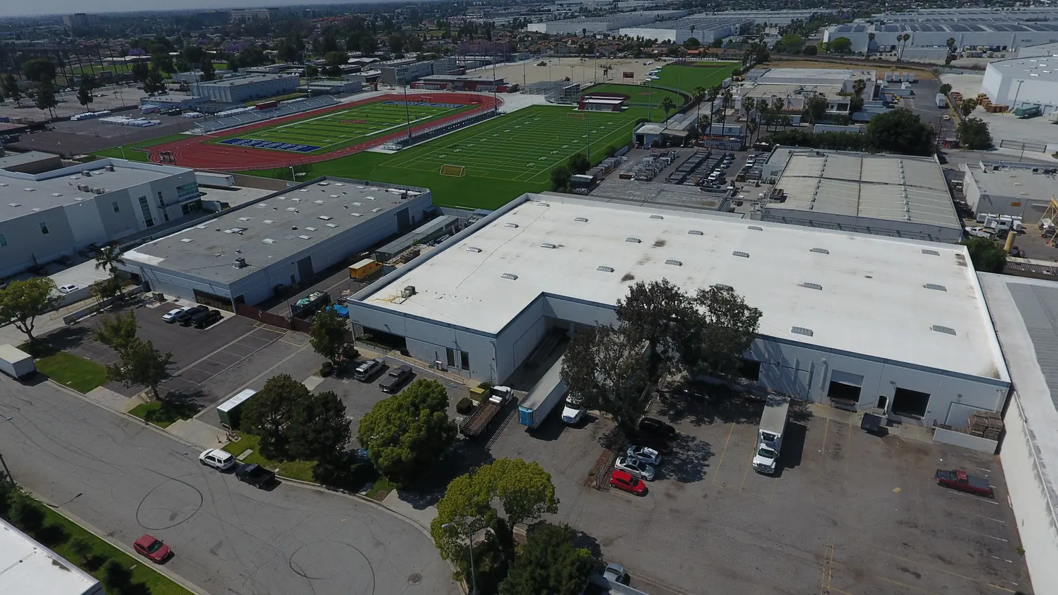 Aerial of an industrial building at 13904 and 13905 Maryton Ave in Santa Fe Springs with a truck court and parking