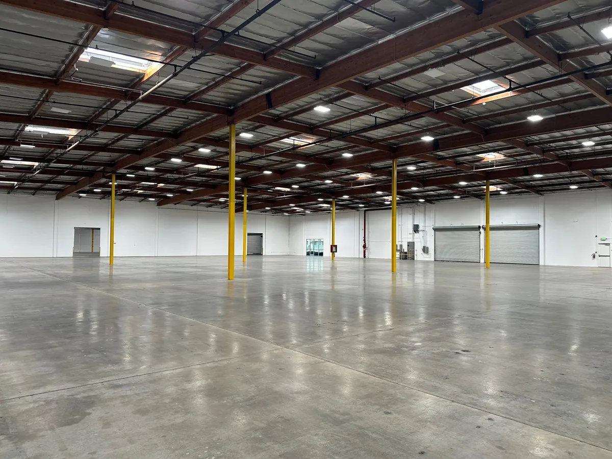 Warehouse interior with LED lighting and roll up doors in Pico Rivera